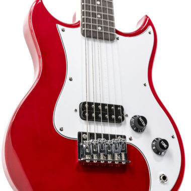 closeup of body of red VOX mini electric guitar